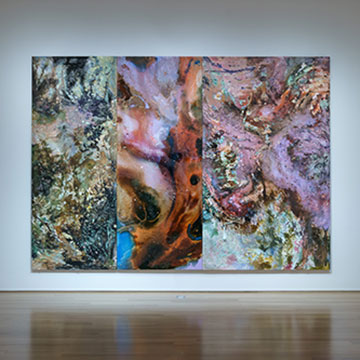 three large abstract paintings by Gabriel Mills hang on the gallery wall at the Nerman