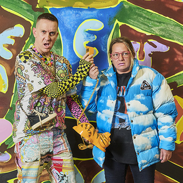 Jeremy Scott stands next to Katherine Bernhardt.